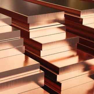 copper flat bars stacked on top of each other in three piles