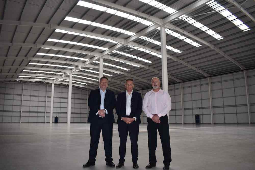 Nigel Evans, Kevin Draper and Steve Dove standing in Metelec's new UK headquarters